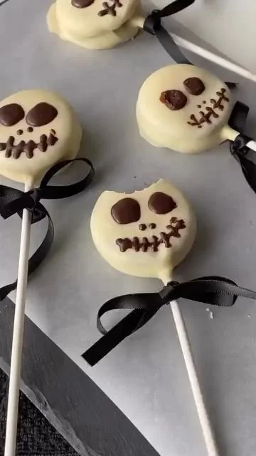 Halloween Skeleton Oreos decorated with spooky designs for the holiday