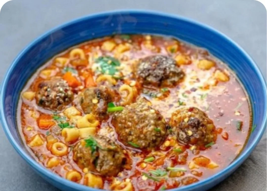 Delicious meatball soup with tender meatballs and firm pasta in a bowl