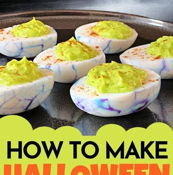 Halloween themed deviled eggs decorated to look spooky