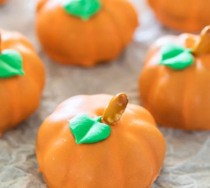 Delicious Pumpkin Oreo Balls served on a autumn-themed plate