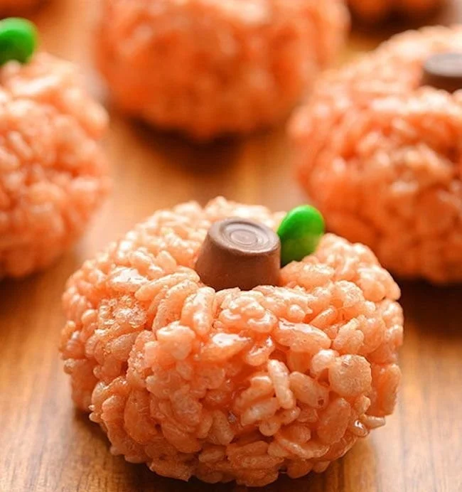Halloween-themed Rice Krispie Treat Pumpkins, a festive dessert idea.